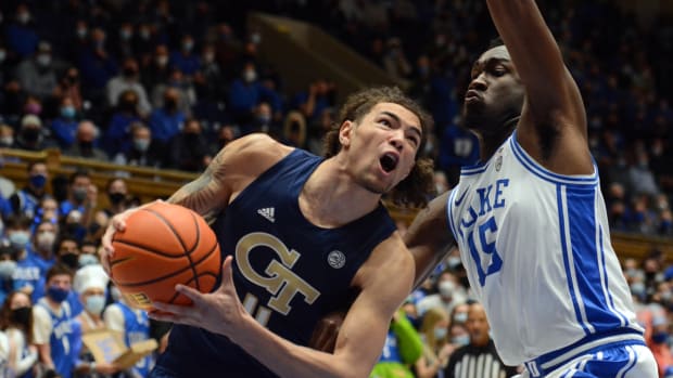 Jan 4, 2022; Durham, North Carolina, USA; Georgia Tech Yellow Jackets forward Jordan Usher (4) drives to the basket as Duke Blue Devils center Mark Williams(15) defends during the first half at Cameron Indoor Stadium. Mandatory Credit: Rob Kinnan-USA TODAY Sports
